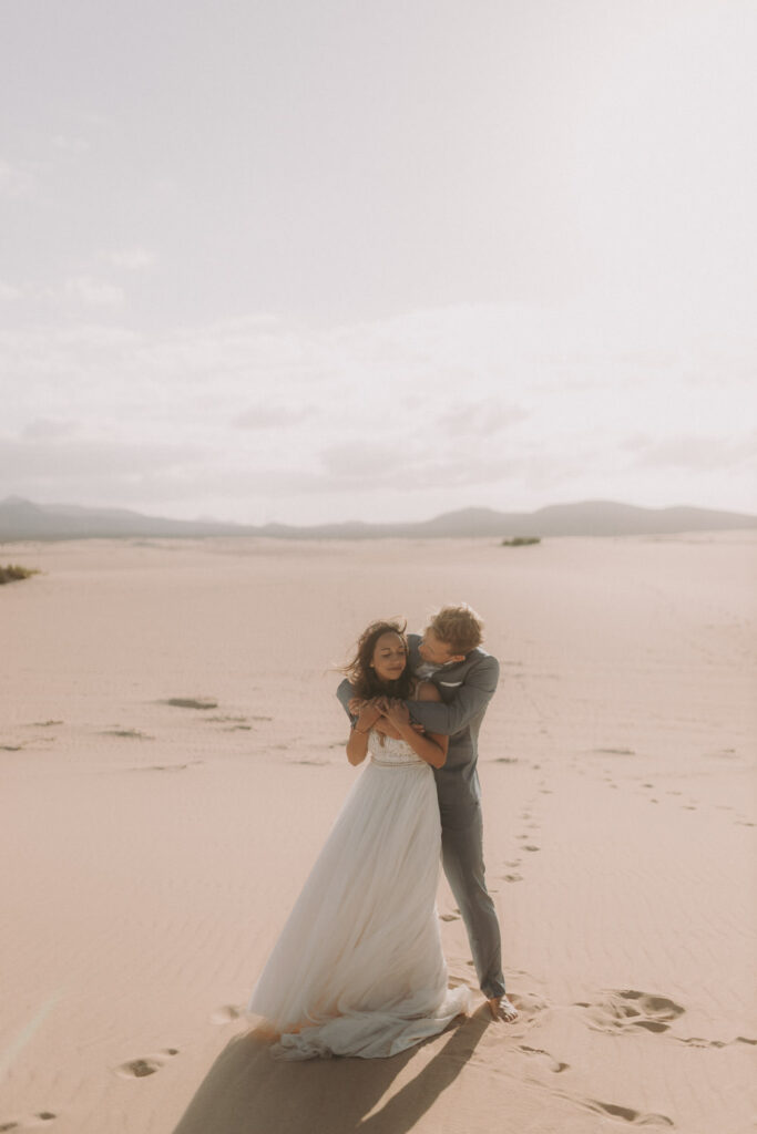 Romantic desert wedding couple portrait by photographer in Spain